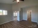 Bright bedroom with wood floors, neutral walls, high ceilings, and ample closet space, creating a comfortable and inviting atmosphere at 18840 Nautical Dr # 57, Cornelius, NC 28031