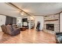 Inviting living room features a stone fireplace, wood trim, and comfortable seating at 4285 Dc Dr, Concord, NC 28025