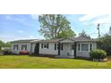 Lovely single-story home with gray siding, black shutters, and a well-maintained front lawn at 4790 Polk Ford Rd, Stanfield, NC 28163