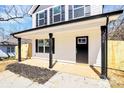 Inviting front porch with black columns and modern black door with house number 624 visible at 513 Harrel St, Salisbury, NC 28144