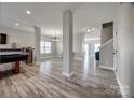 Spacious living room with new floors, modern gray paint, and an open floor plan at 10071 Highland Creek Cir, Indian Land, SC 29707