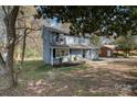 Charming blue two-story home with black shutters, side yard, and mature landscaping at 1024 Eaglewood Ave, Charlotte, NC 28212