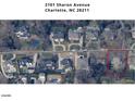 Aerial view of 2101 Sharon Avenue showing surrounding houses and landscaping in the upscale neighborhood at 2101 Sharon Ave, Charlotte, NC 28211