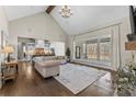 Open living space with a large window overlooking a patio, flowing into kitchen and dining area at 2616 Lee Lawing Rd, Lincolnton, NC 28092
