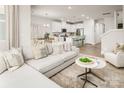 Inviting open-concept living room flowing into a modern kitchen and dining area, ideal for entertaining at 3063 Finchborough Ct # 216, Charlotte, NC 28269