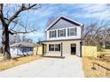 Charming two-story home featuring a modern design, new driveway, and a freshly installed wooden fence at 515 Harrel St, Salisbury, NC 28144