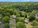 Serene aerial view showcases a neighborhood surrounded by lush greenery near city skyline at 5316 Rupert Ln, Charlotte, NC 28215