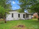 Beautifully updated white brick home with manicured lawn, fresh landscaping and charming appeal at 5316 Rupert Ln, Charlotte, NC 28215