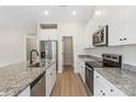 Gorgeous kitchen featuring granite countertops, stainless steel appliances, and pantry at 5613 Skinny Dr, Charlotte, NC 28215