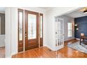 Bright foyer with hardwood floors, decorative glass door, and view into another room at 615 Vega Nw St, Concord, NC 28027