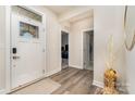 Inviting entryway with light-colored walls and a modern front door at 6419 Cambridge Dr, Harrisburg, NC 28075