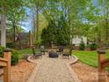 Backyard fire pit area with comfortable seating, perfect for outdoor entertaining at 9009 Stourbridge Dr, Huntersville, NC 28078