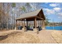Lakeside pavilion with stone accents, offering an elegant outdoor entertaining space at 108 Helm Ln # B, Mooresville, NC 28117