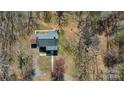 Bird's eye view of a house, surrounded by trees, revealing the shape of the roof and landscaping at 1350 Hulls Grove Church Rd, Vale, NC 28168