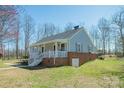 The house features a sturdy brick foundation and an expansive lawn, a shed, and a boat carport at 1350 Hulls Grove Church Rd, Vale, NC 28168