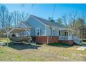 View of a house with a boat carport, showing the house's siding and roof at 1350 Hulls Grove Church Rd, Vale, NC 28168