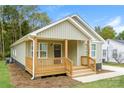 Single-story home with a cozy front porch and neat landscaping at 1429 Edgewood Dr, Rock Hill, SC 29730