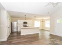 Bright, open-concept living space with modern flooring, a kitchen island, and stainless steel appliances at 1429 Edgewood Dr, Rock Hill, SC 29730