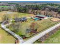 Expansive estate featuring a pool, horse paddock, outbuilding, and a beautifully maintained brick home at 1790 Faires Rd, Rock Hill, SC 29730