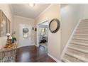 Welcoming entryway featuring a staircase, mirror, and decor that enhances the home's interior at 3034 Oakmere Rd, Waxhaw, NC 28173