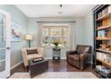 Bright living room featuring stylish chairs, a window that provides natural light, and elegant decor at 3034 Oakmere Rd, Waxhaw, NC 28173