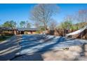 Outdoor pool with a diving board and a brick fence, perfect for summer fun and relaxation at 3442 Lester St, Conover, NC 28613