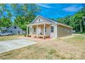 Well-maintained single story home with a welcoming front porch and new concrete driveway at 406 White Store Rd, Wadesboro, NC 28170