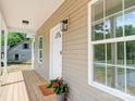 Charming front porch featuring a new wood deck and classic design details, and lots of light at 406 White Store Rd, Wadesboro, NC 28170