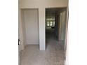 Unfinished hallway featuring neutral walls and trim, offering a blank canvas for customization at 406 White Store Rd, Wadesboro, NC 28170