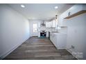Bright kitchen featuring new appliances, white cabinets, and a door to the backyard at 621 Cauthen St, Rock Hill, SC 29730