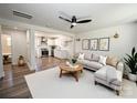 Inviting living room featuring a ceiling fan and a modern kitchen in the background at 621 Cauthen St, Rock Hill, SC 29730