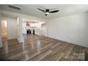 Open living room with modern lighting and an adjoining open kitchen at 621 Cauthen St, Rock Hill, SC 29730