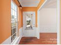 View of entry way with hardwood floors, white trim and a large window providing plenty of light at 1005 Sweetleaf Dr, Fort Mill, SC 29707