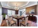 Elegant dining room featuring modern chandelier, hardwood floors, and stylish decor at 10123 Barrands Ln, Charlotte, NC 28278