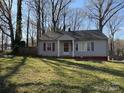 Charming single story house with red shutters and a quaint front porch at 1027 Morningside Park Dr, Gastonia, NC 28054