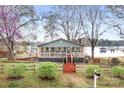 Charming waterfront home with a spacious porch and beautiful lake views at 119 Hogan Ln, Mooresville, NC 28117