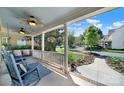 Inviting front porch with rocking chairs, porch swing, and hanging plants creating a relaxing outdoor space at 1569 Benjamen Latrobe Cir, Fort Mill, SC 29708