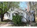 Inviting two-story home with classic architecture, white siding, and a well-maintained yard at 234 S Ervin Ave, Newton, NC 28658