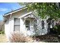 Charming two-story home with white siding, a covered entryway, and a cozy feel at 234 S Ervin Ave, Newton, NC 28658