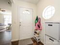 Bright entryway with a front door, dark floors, and a round window for natural light at 2518 Eargle Rd, Charlotte, NC 28269