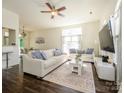 Spacious living room with neutral tones, dark floors, bright windows, and comfortable seating at 2518 Eargle Rd, Charlotte, NC 28269