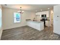 Modern kitchen with white cabinets, granite countertops, and stainless steel appliances at 347 Sidney St, Rock Hill, SC 29730