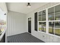 Charming front porch with sleek black door and white accents at 416 Clinton Ave, Lancaster, SC 29720