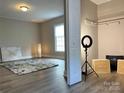 A charming bedroom with neutral walls, carpet, a window, and a touch of modern decor at 507 E Maple Ave, Gastonia, NC 28054
