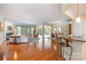 Spacious open-concept living area with hardwood floors and seamless flow to other rooms at 10432 Bethpage Dr, Indian Land, SC 29707