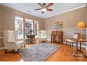Cozy living room with natural light, hardwood floors, and inviting seating area at 10432 Bethpage Dr, Indian Land, SC 29707