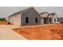 Modern new construction home with a two car garage and gray and white siding at 1370 Coppergate Dr, Salisbury, NC 28147