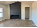 Bright living room with modern fireplace and high ceilings, perfect for relaxation at 1370 Coppergate Dr, Salisbury, NC 28147