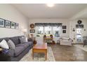 Inviting living room with a large window, hardwood floors, and stylish decor at 14073 Clayborn St, Midland, NC 28107