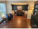 Elegant dining room features hardwood floors, decorative molding, modern lighting, and stylish furnishings at 14117 Hiawatha Ct, Huntersville, NC 28078